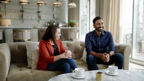 a man and a woman sitting on a couch