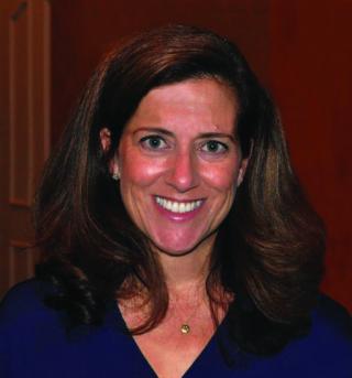 a woman smiling for the camera