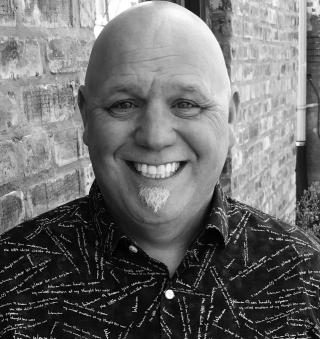 a man smiling for the camera
