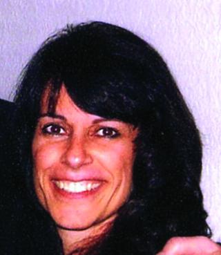 a woman smiling for the camera