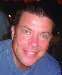 a man smiling for the camera