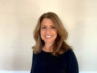 a woman smiling for the camera