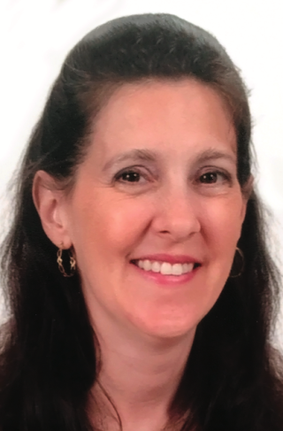a woman smiling for the camera
