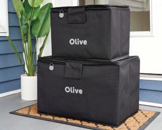 a piece of luggage sitting on top of a suitcase