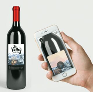a hand holding a bottle